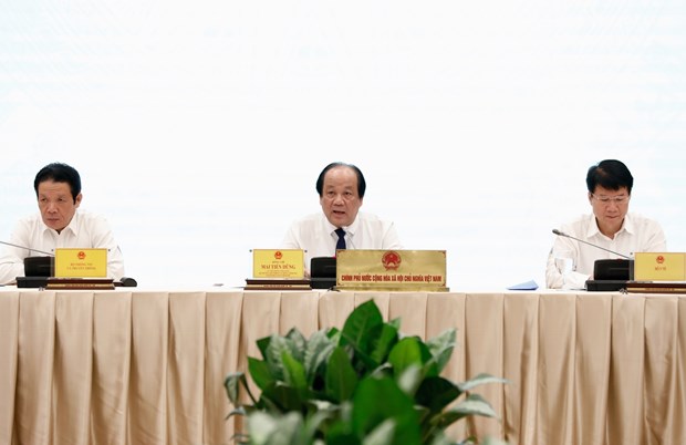 Minister, Chairman of the Government’s Office and Spokesman of the Government Mai Tien Dung (centre) at the press conference on August 3 (Photo: VNA)