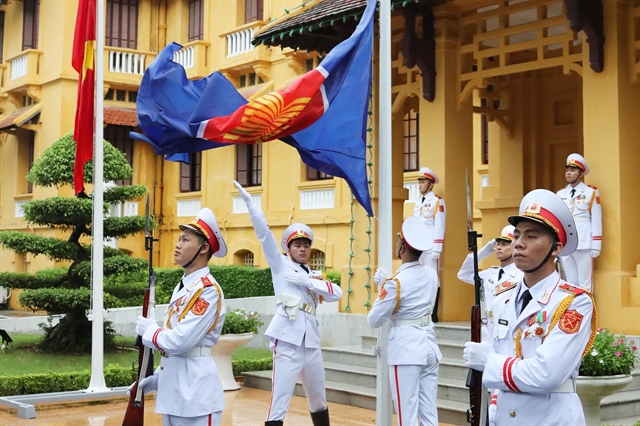 Vietnamese honourary guards carry out the flag hoisting ceremony. — VNA/VNS Photo Lâm Khánh