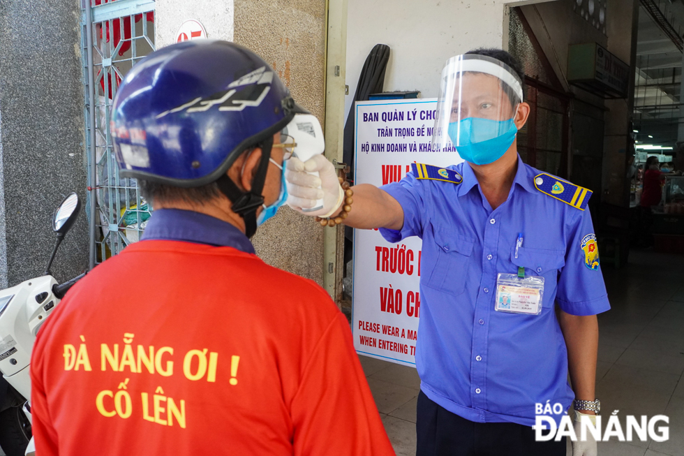 Stallholders and shoppers at local markets have their body temperature checked, and are required to frequently clean their hands and wear face masks, before entering markets.