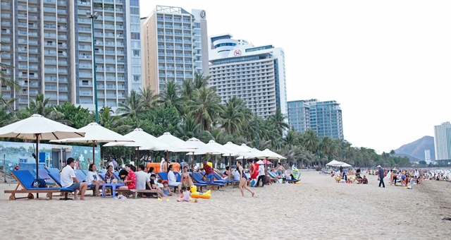 Tourists at a beach in Nha Trang City.