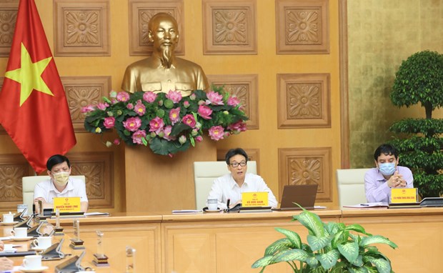 Deputy Prime Minister Vuc Duc Dam chairs the meeting of the national steering committee for COVID-19 prevention and control in Hanoi on August 20. (Photo: VNA)