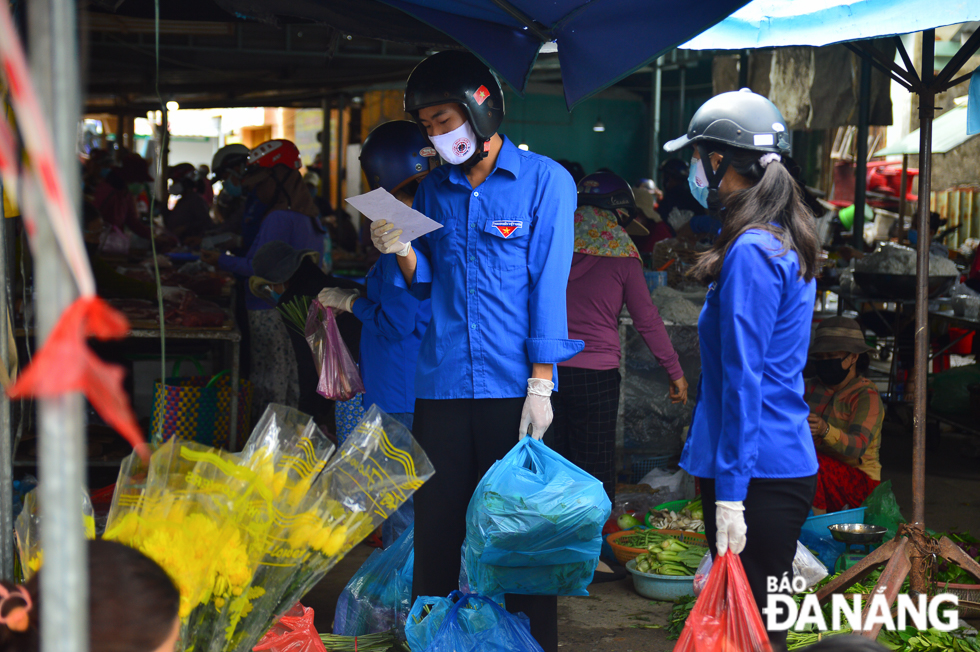 They carefully checking lists of food items needing to be bought