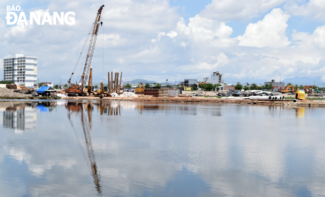 Work resumed on the construction site of a project to build a bridge spanning the Co Co River 