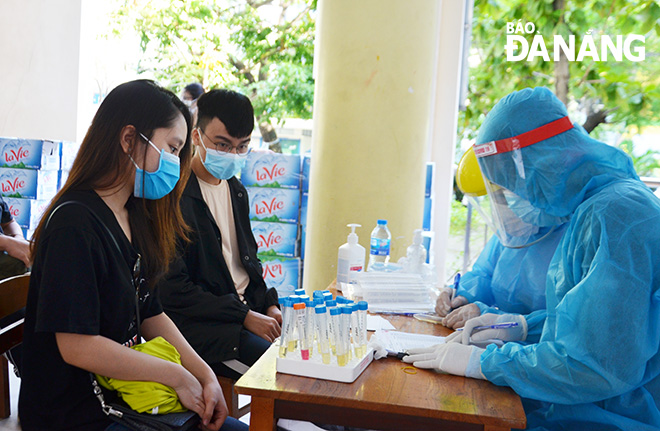  Medical staff carefully recording the candidates’ personal information, including their names and ages, before sample taking