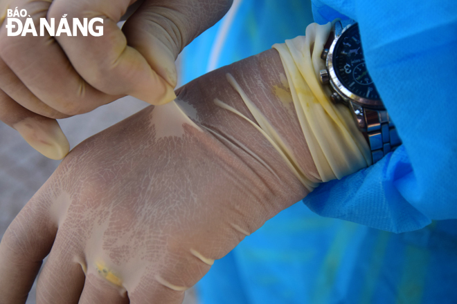 Medical workers wearing personal protective gears with medical gloves during sampling collecting