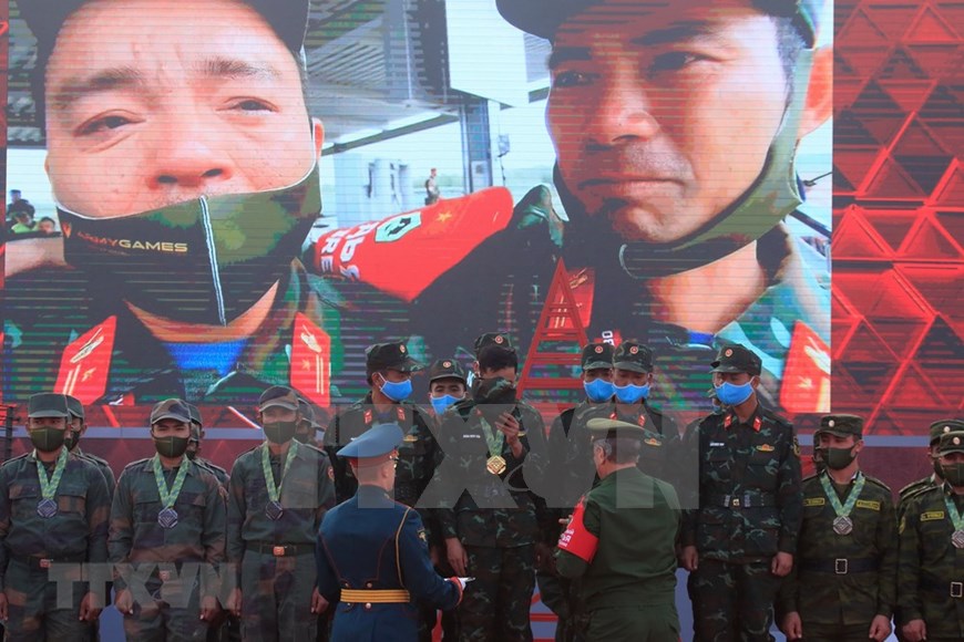 The team receives enthusiastic cheers from Vietnamese spectators and foreign friends