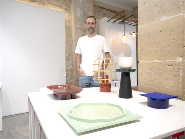 Designer Guillaume Delvigne poses with his lacquer creations at the Paris Design Week. (Photo courtesy of Hanoia)