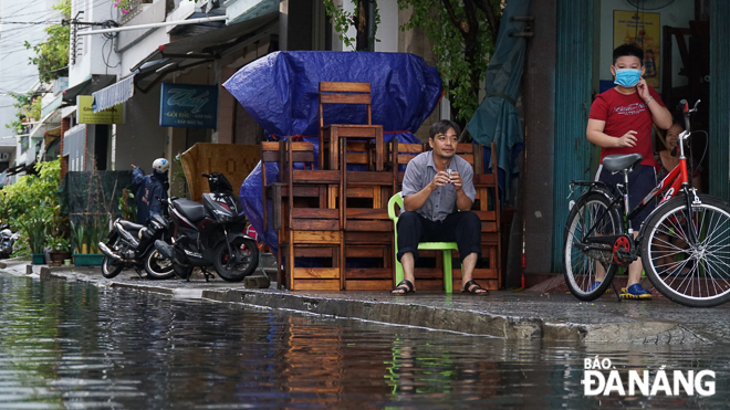 A large amount of rainwater spilling over pavements