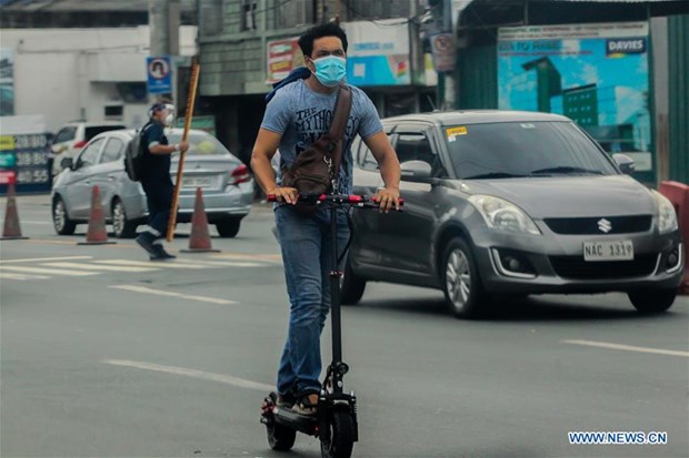 A man wearing a face mask rides his scooter in Manila, the Philippines, Sept. 16, 2020. (Photo: Xinhua)