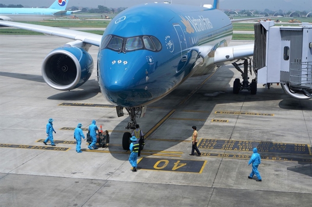 The first international flight to Việt Nam, operated by Vietnam Airlines, landed at Nội Bài International Airport on September 25 after the second wave of the COVID-19 outbreak was controlled