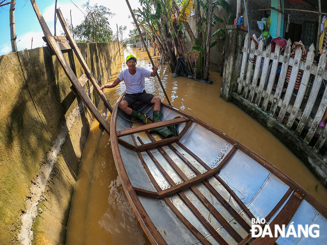 Le Son Nam village was still only fully accessible by boat on Thursday afternoon