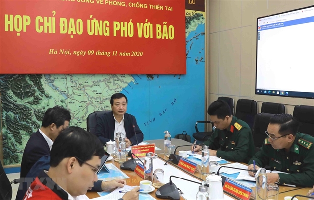 Trần Quang Hoài, deputy head of the Central Steering Committee on Natural Disaster Prevention and Control, chairs a meeting yesterday in Hà Nội to direct localities preparing for Typhoon Etau.