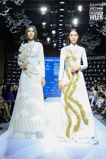 Two áo dài (Vietnamese traditional dress) design by Minh Châu. — Photo courtesy of the organiser