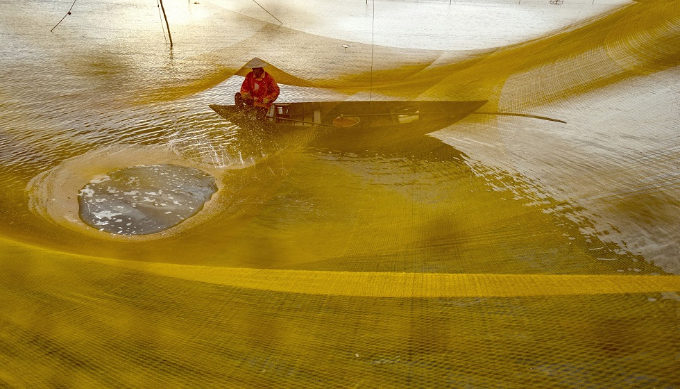  A fisherman taking a rest after cast netting