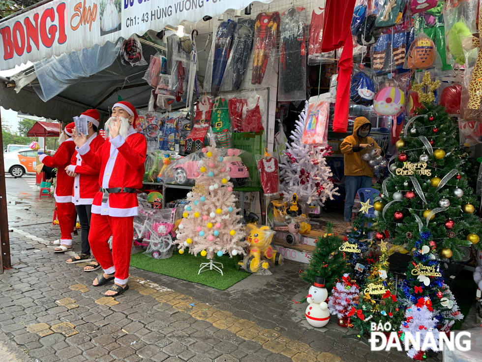 The bustling trading ambience recorded at a city centre-based shop displaying a wide range of highly enticing Christmas products for sale