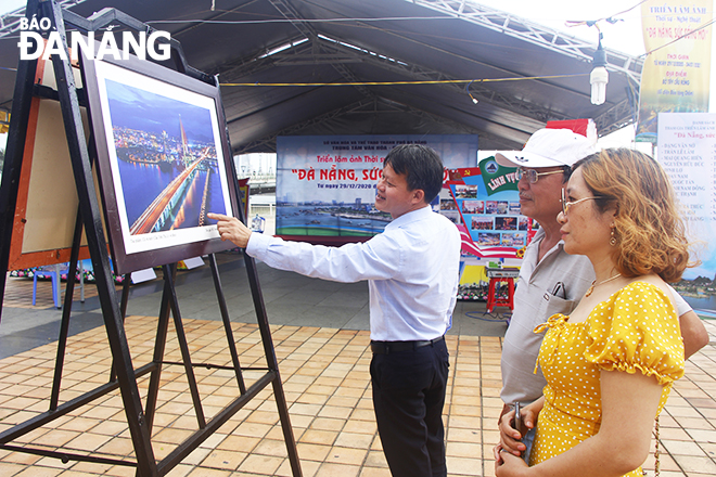 The ongoing ‘Da Nang, New Vitality’ photo exhibition at the western side of the Rong (Dragon) Bridge, opposite the Museum of Cham Sculpture, attract a great deal of attention from locals and visitors