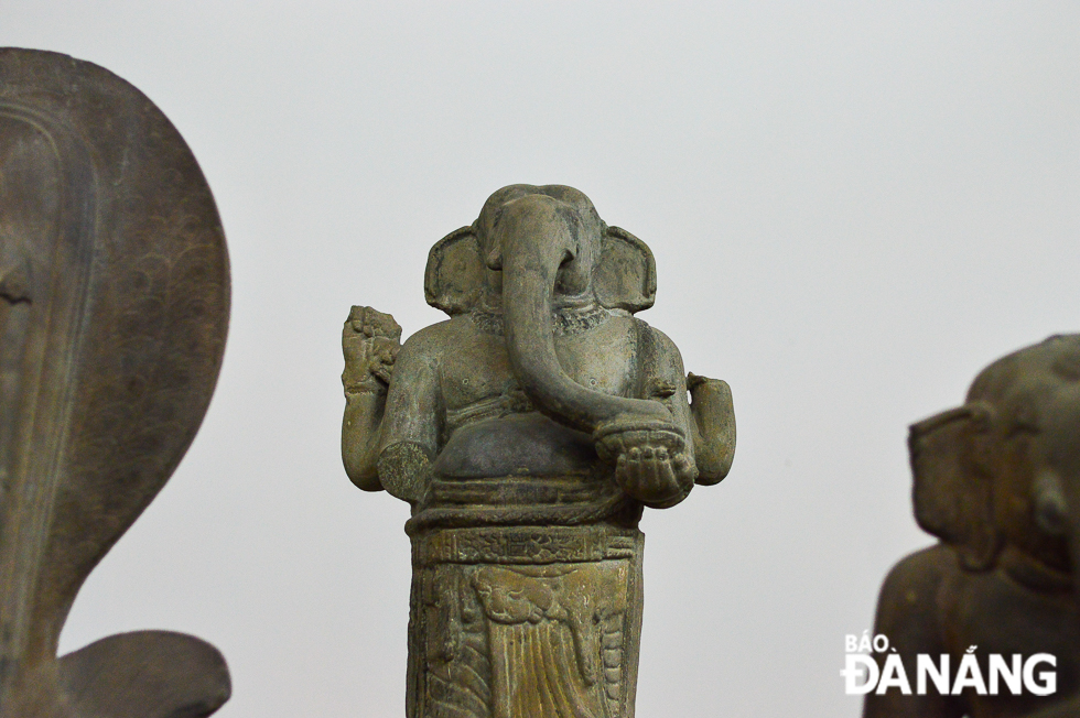 In religious sculpture, Ganesha is depicted with an elephant's head with softly curling trunk.and rotund human body, two or four arms, but occasionally more. The Hindu god is widely worshiped in India, Sri Lanka, Bangladesh, Nepal and many Southeast Asian countries. In Vietnam, artworks depicting Ganesha can be found in the Champa and Oc Eo cultures.