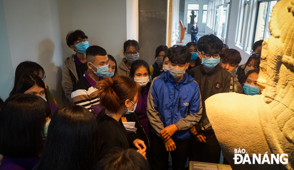 Da Nang's pupils and students learning about the precious artifacts on display at the Da Nang Museum of Cham Sculpture