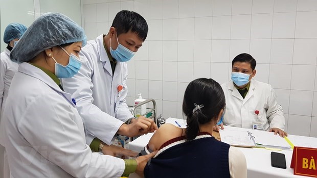 A volunteer is given a shot of the 75mcg dose of Nanocovax on January 12 (Photo: VNA)