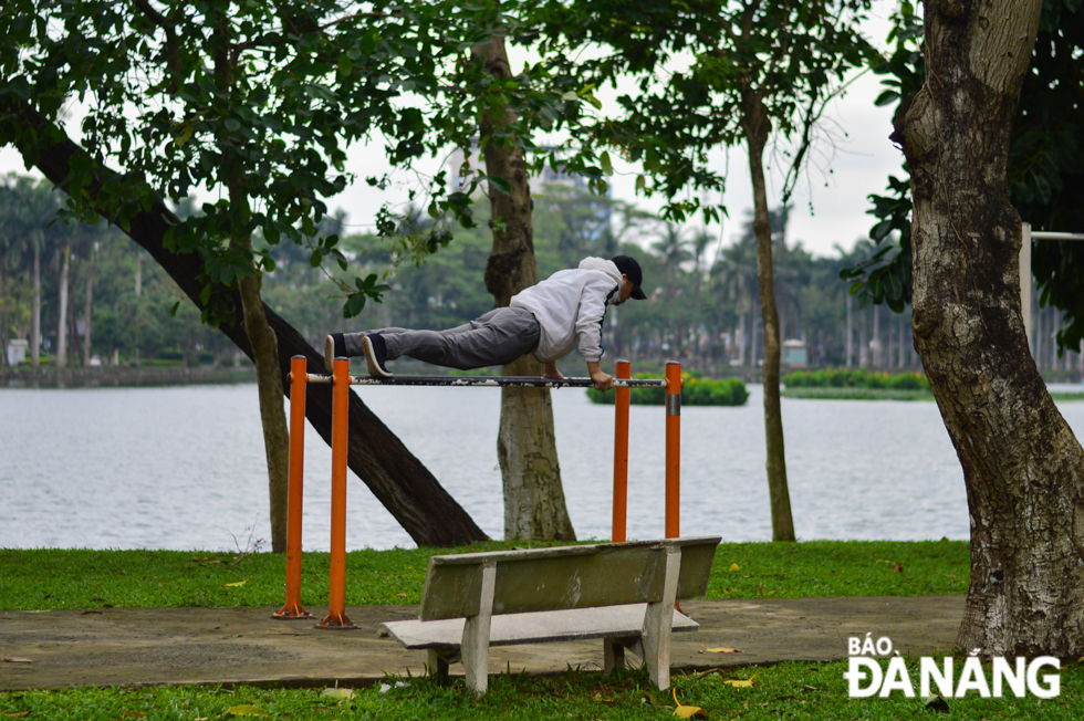 A man doing exercises in cold weather at the 29 March Park