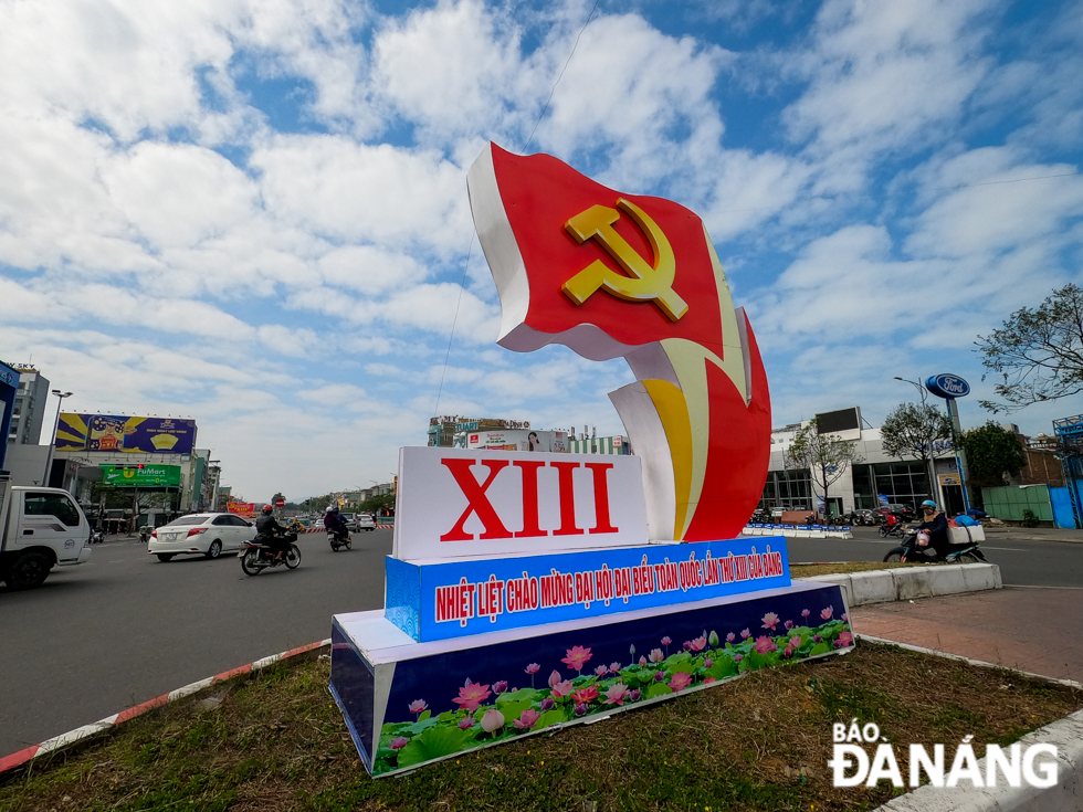 A big-sized symbol of national flag with hammer and sickle in yellow on a red background placed at the intersection of Dien Bien Phu and Nguyen Tri Phuong streets