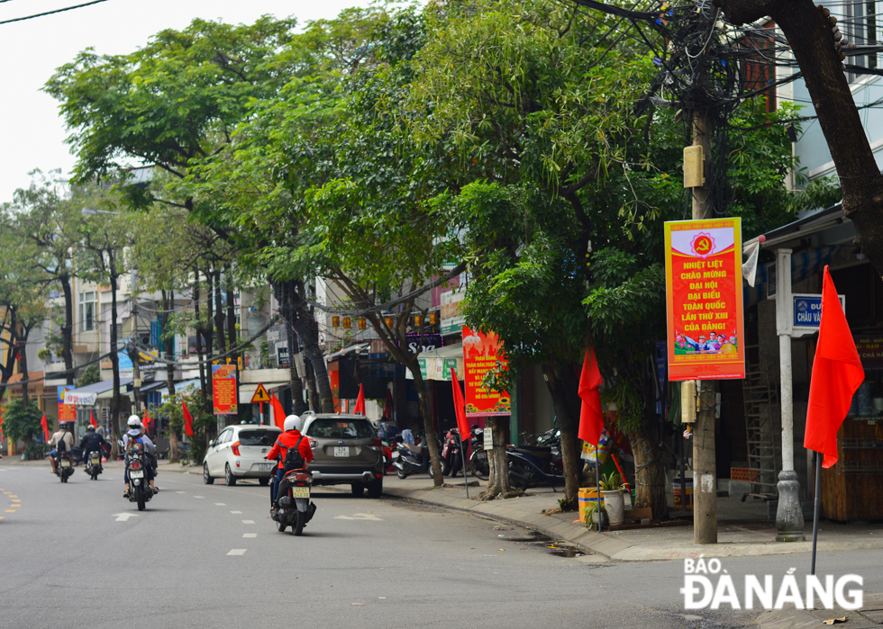 Vietnamese national flags hung along Dong Da Street