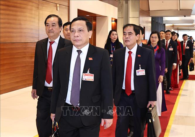 Các đại biểu đến dự ngày làm việc thứ ba Đại hội XIII của Đảng. Ảnh: TTXVN