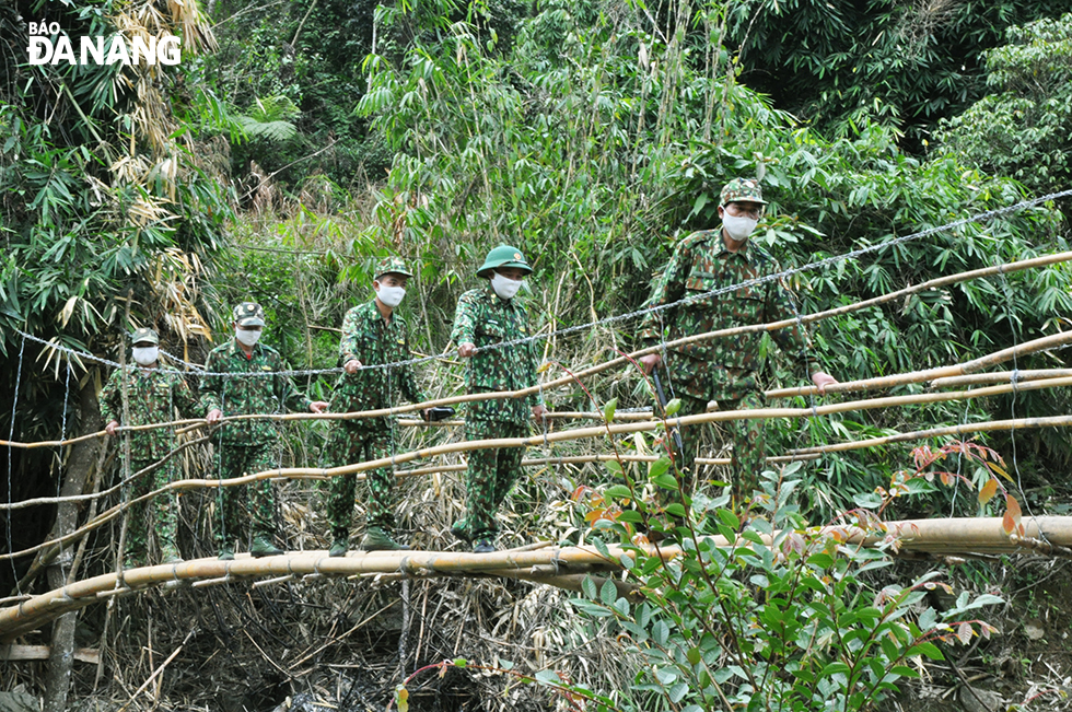  Officers and men from the Ga Ry Border Guard Station recently crossed a temporary bamboo bridge during their tough inspection journey