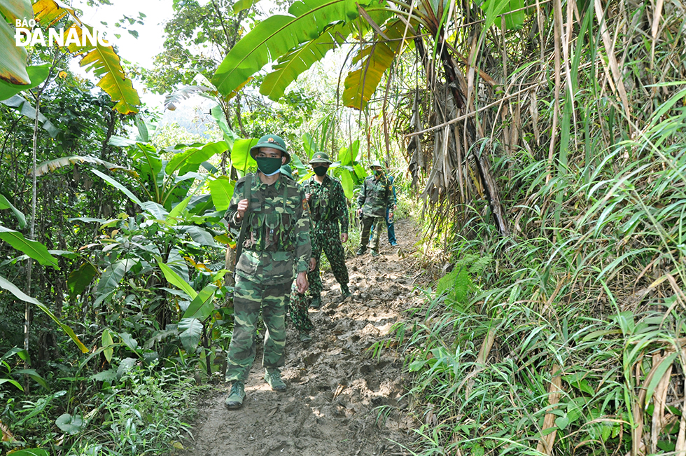 Those from the A Xan Border Guard Station are seen travelling along an unmanned paths and trails.