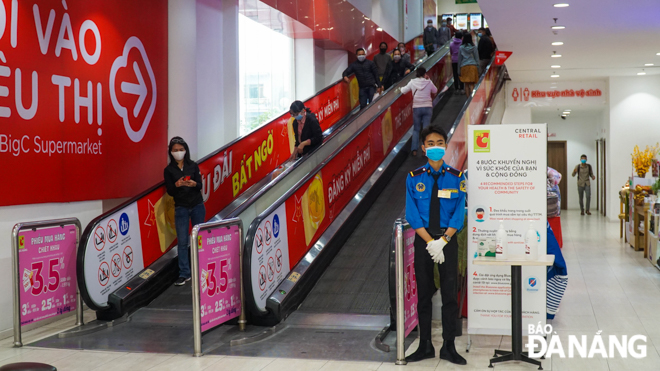 Staff and shoppers at the Big C Supermarket obey the face mask rules