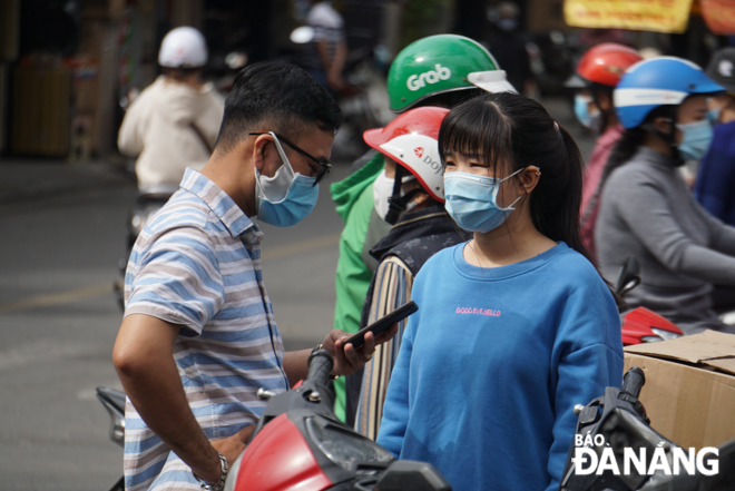 Locals wear face masks whenever communicating with others in public…