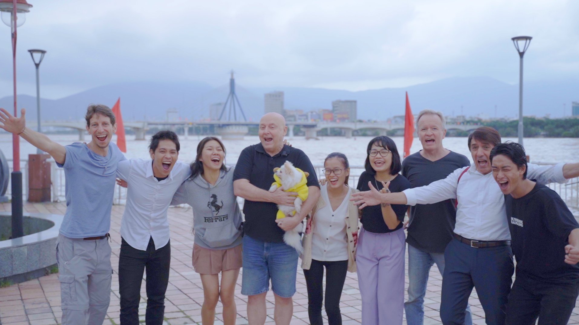 Tourists are excited to pose for a group photo with the image of Chatbox used in the music video 