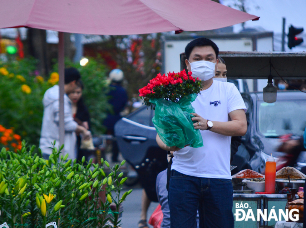 A man has already chosen a satisfactory flower pot