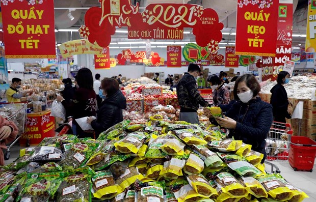 Consumer demand is increasing sharply ahead of Tet thanks to steady prices and rising incomes (Photo: VNA)