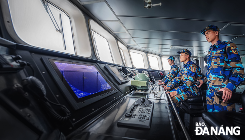 Mr Phung The Thang (right), the captain of the coast guard ship CSB 4037, commanding the ship to leave the port.