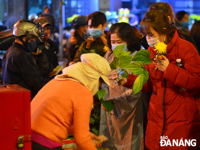 Buying buds at a pagoda