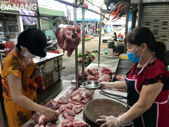 A kiosk selling pork meat at the Con Market