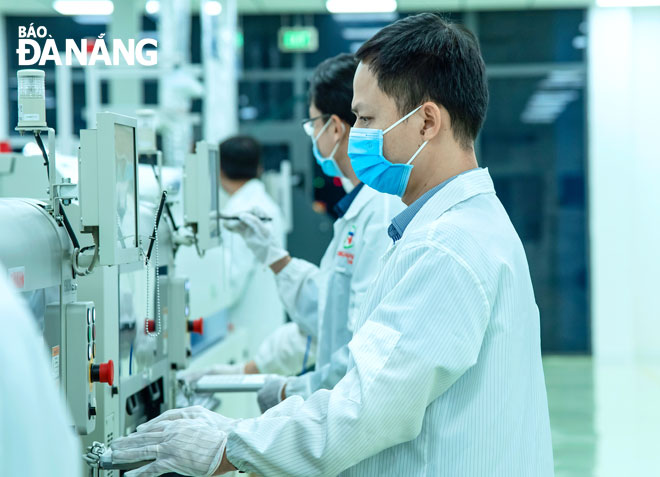 Production activities seen at the surface-mount technology (SMT) assembly and manufacturing plant, located in the Da Nang Hi-Tech Park