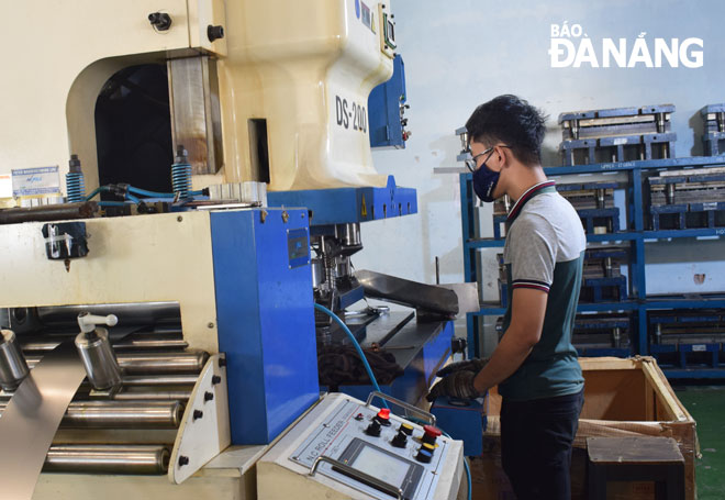 Workers at the Hifill JSC, one of the city-based businesses operating in the supporting industries