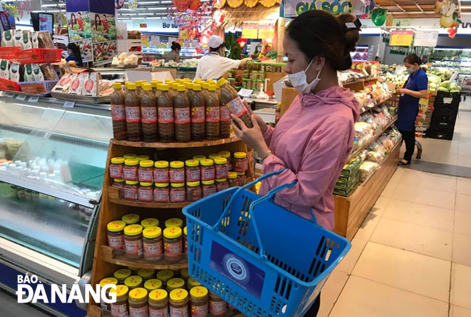 Da Nang's typical products are increasingly being bought by loca residents. Di Can (salted fish) products are on display for sale at the Co.opMart Da Nang.