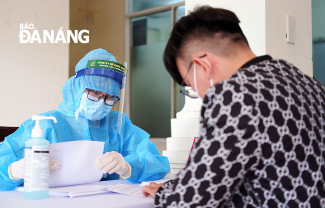 The medical workers completing personal information declarations prior to getting COVID-19 vaccine