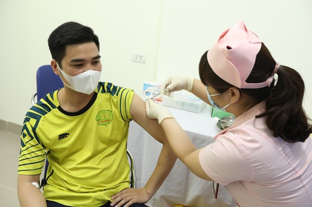 A volunteer is given a shot of COVIVAC on March 23 (Photo: VNA)