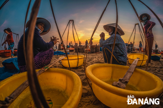 The bustling ambience created by seafood trading activities recorded on a beach