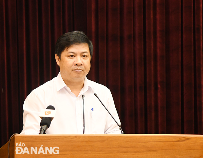 Municipal Party Committee Deputy Secretary cum municipal People's Council Chairman Luong Nguyen Minh Triet addressing the Friday meeting. 