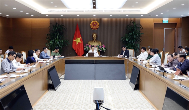 Deputy Prime Minister Vũ Đức Đam chairs the meeting of the National Steering Committee on COVID-19 Prevention and Control on Wednesday. — VNA/VNS Photo Phạm Kiên