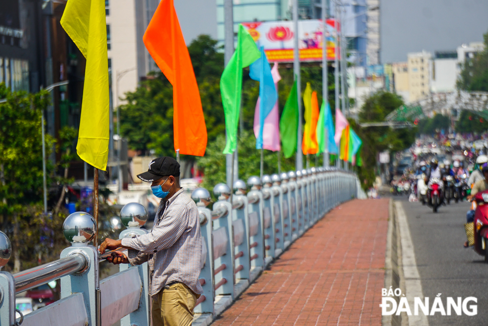 Colourful flags are placed on bridges spanning the iconic Han River