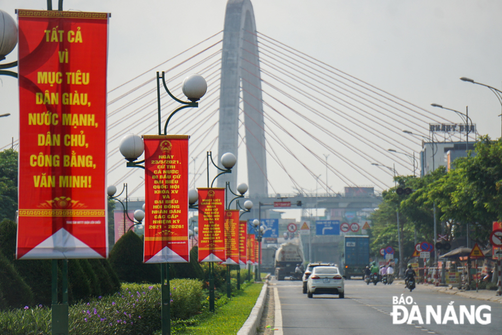  A chain of banners promotes the elections of deputies to the 15th National Assembly and all-level People's Councils for the 2021-2026 tenure on a section of Truong Chinh Street.