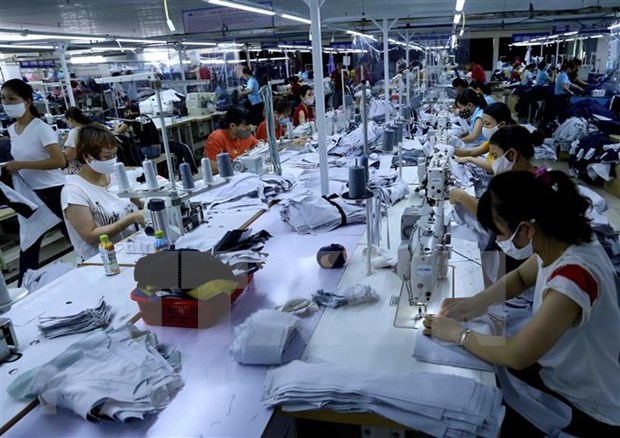 Production of garment for export to Japan. (Photo: VNA)