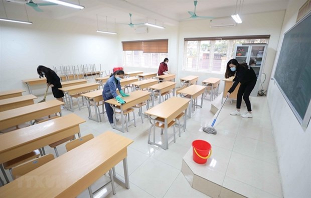 A classroom is being disinfected during students halting going to school due to COVID-19 outbreak in many cities and provinces across the country. (Photo: VNA)