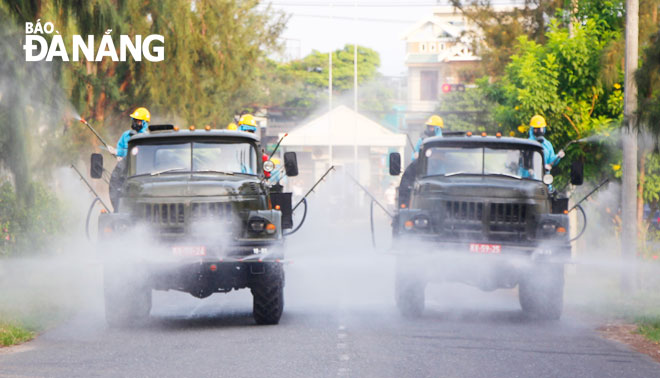 Disinfectant sprays for the prevention of COVID-19 was conducted in this industrial park and surrounding areas on Wednesday, following the detection of a positive case here. Photo: XUAN DUNG